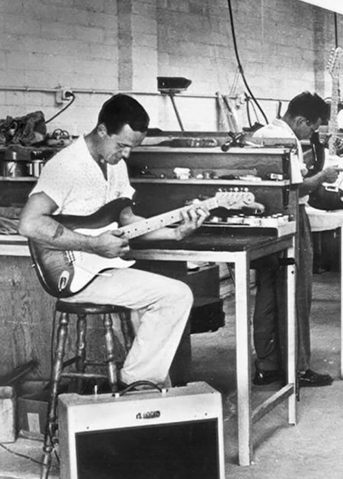 George Fullerton testing a Stratocaster in the Fender factory, sometime in the mid-to-late 1950s. Photo courtesy of Richard Smith.